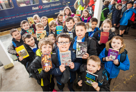 Children from St Martin's school, Liskeard, bring a book as their 'ticket' to travel. Photo credit: GWR