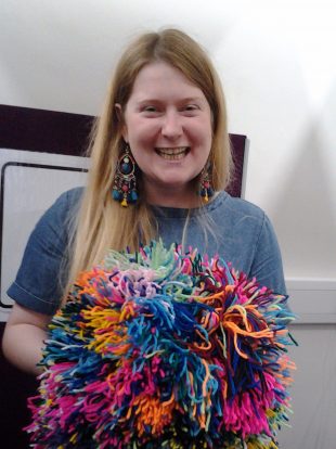 Playing with PomPoms. Photo credit: Surrey Libraries